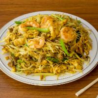 Singapore Noodles · With shrimp, beef and chicken in special curry spicy sauce. With carrots, onions, scallions,...