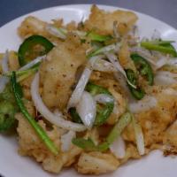 Fried Calamari · Fried tempura battered calamari stir-fried with garlic, white onions, spring onions, and sea...