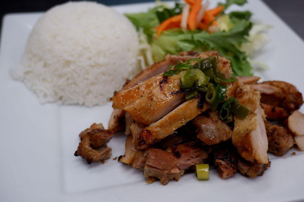Rice (Grilled Meats) · Marinated and charcoal grilled meats served with mixed greens, pickled carrots, green onions, and fish sauce. Side of white jasmine rice.