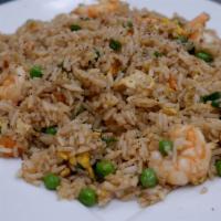 Fried Rice · Stir fried rice with egg, green onions, peas, carrots, and soy sauce.