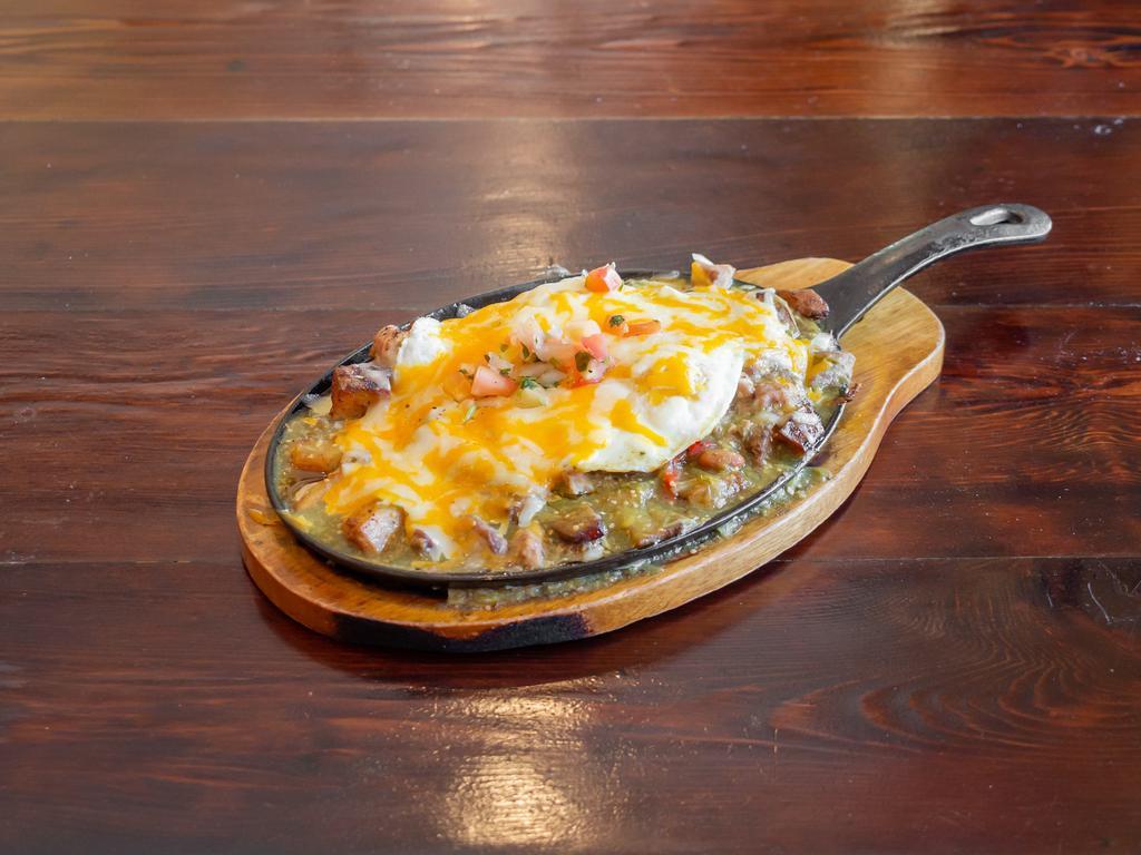 Chile Verde Skillet · Braised pork Chile Verde, home fries, eggs, pico de gallo and cheese. Served with tortillas.