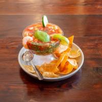Shrimp Coctel · Mexican style shrimp cocktail. Combination of shrimp, avocado, tomatoes, onions, cucumbers a...