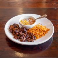 Al Pastor · Tender pork strips marinated in a citrus pineapple-achiote sauce. Served with beans, rice an...