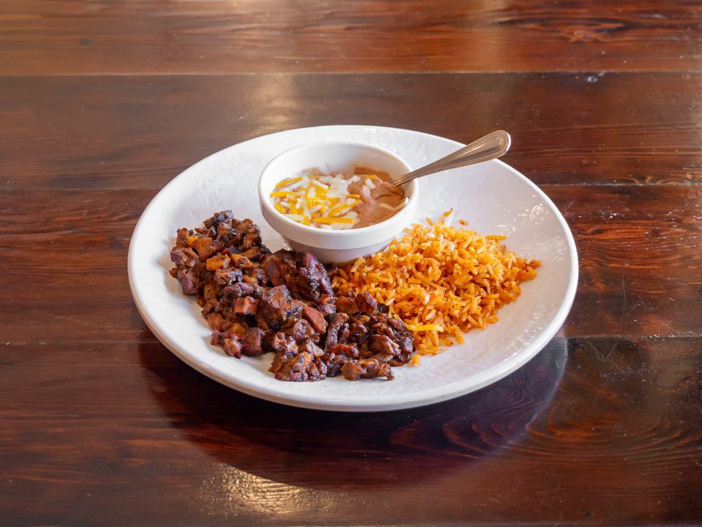 Al Pastor · Tender pork strips marinated in a citrus pineapple-achiote sauce. Served with beans, rice and tortillas.