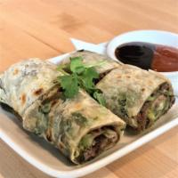 Beef roll  · scallion pancake wrapped with oxtail beef, cucumbers, green onions, & cilantro. served with ...