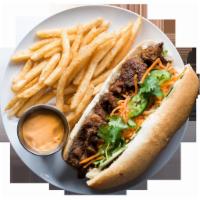 Grilled Pork Sandwich with Fries and a Drink · Pickled carrots and daikon, cucumber, green onions, cilantro, jalapeno, and mayo.