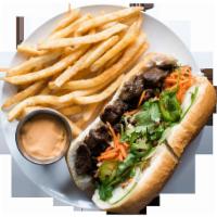 Grilled Pork and Beef Sandwich with Fries and a Drink · Pickled carrots and daikon, cucumber, green onions, cilantro, jalapeno, and mayo.
