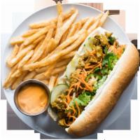 Mock Duck Curry Sandwich · Pickled carrots and daikon, cucumber, green onions, cilantro, jalapeno, and mayo.