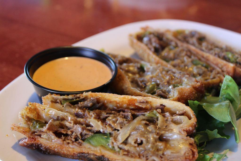 Steak & Cheese Egg Rolls · Hand rolled, shaved rib-eye steak, monterey jack, peppers, onions, and chipotle ranch.