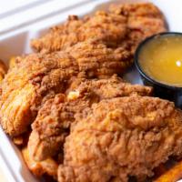 Chicken Tenders · Buttermilk crispy chicken tenderloins, your choice of one side and one sauce.