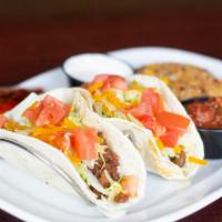 Homestyle Beef Tacos · 2 tacos made on warm flour tortillas. Two seasoned ground beef soft tacos, shredded lettuce,...
