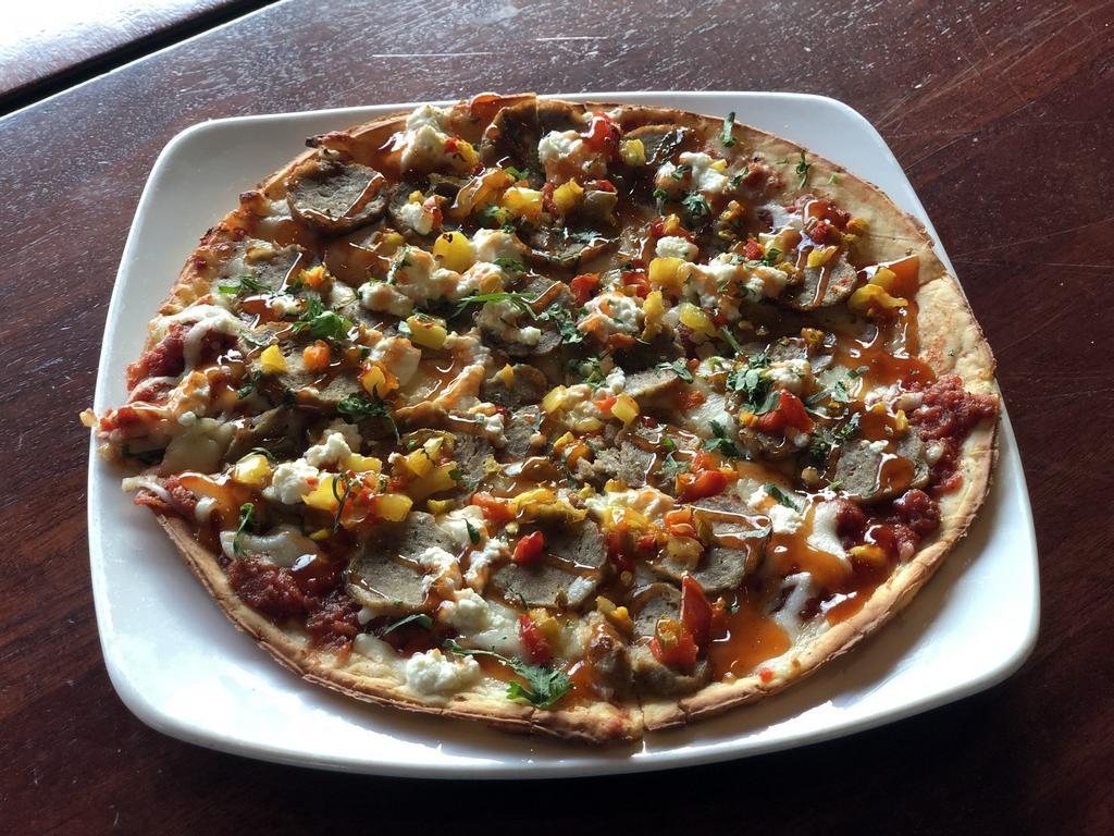 Angry Meatball & Ricotta Pizza · Calabro ricotta cheese, sliced meatballs, chopped rhode island peppers, pizza sauce, mozzarella & drizzle of hot honey on your choice of crust