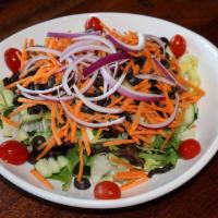 Garden Salad · Iceberg and romaine lettuce, red onions, plum tomatoes, cucumbers, shredded carrots, black o...