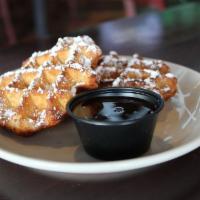 Belgian Waffles (2) · Two (2) pearl sugar belgian waffles dusted with powdered sugar and served with chocolate sau...