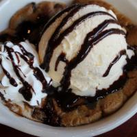 Chocolate Chip Cookie Dough Sundae · Freshly baked chocolate chip cookie topped with vanilla ice cream and chocolate sauce.