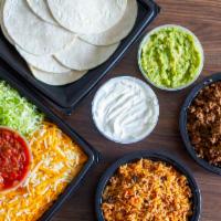 Build Your Own Tacos - FM Style · Flour tortillas (12), seasoned beef, lettuce, salsa, sour cream & spanish rice
