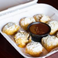 Fried Oreo Puffs - FM Style · 8 Pieces dusted with powdered sugar & chocolate dipping sauce