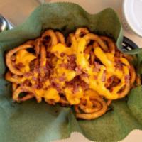 Loaded Twister Fries · Our secretly seasoned french fries covered in melted cheese and bacon bits. Mouth wateringly...
