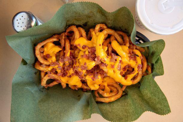 Loaded Twister Fries · Our secretly seasoned french fries covered in melted cheese and bacon bits. Mouth wateringly delicious!