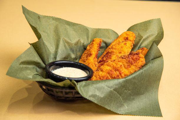 Chicken Tenders · Premium chicken tenders, battered and fried to a delicious golden hue and served with your choice of dipping sauce.  Also available as Buffalo chicken tenders for an additional charge.