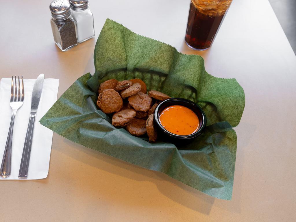 Pickle Chips · A shareable portion of fried pickle chips with boom boom sauce for dipping sauce purposes. It's got a little kick the sauce, not the pickles. If you like that sort of thing!