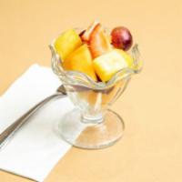 Fruit Salad · Freshly cut cantaloupe and pineapple mixed with red seedless grapes and toped with strawberr...