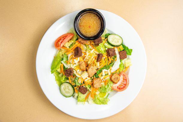 Nature's Garden Salad · A fresh mix of lettuce, tomato, two-cheese blend, cucumbers, carrots, and crunchy croutons served with your choice of dressing.