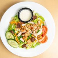 Nature's Garden Grilled Chicken Salad · A fresh mix of lettuce, tomato, two-cheese blend, cucumbers, carrots, and crunchy croutons t...