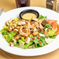 Caesar's Empire Salad with Grilled Chicken · Crisp romaine, tossed in our Caesar dressing with croutons, tomato, shredded Parmesan cheese...