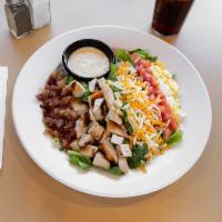 Cobb Salad · A beautiful combination of juicy grilled chicken, crisp bacon, chopped boiled egg, diced tom...