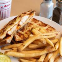 Buffalo Waffled Grilled Cheese · Crispy, juicy chicken tenders covered with spicy frank's red hot sauce and topped with melte...