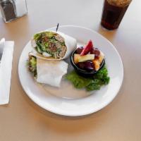 Grilled Chicken Caesar Wrap · Sliced, grilled chicken with crisp romaine lettuce, tomato, bacon bits, crunchy croutons, Pa...