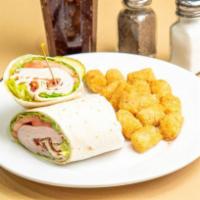 Turkey Club Wrap · Thinly sliced deli turkey, crisp bacon, lettuce, tomato, and mayo in a white or wheat wrap.