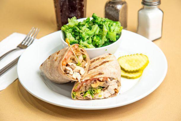 Grilled Balsamic Chicken Wrap · Juicy grilled chicken with grilled onion, sauteed mushrooms, crisp lettuce, chopped tomato, and balsamic vinaigrette in a wheat wrap.