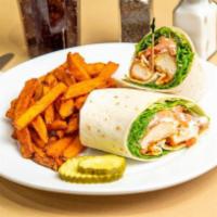 Buffalo Chicken Wrap · Breaded and fried Buffalo style chicken tenders served with crisp lettuce, tomato, and bleu ...