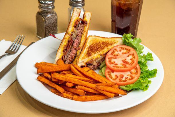 Smokey Mountain BBQ · Cheddar cheese, crisp bacon, sauteed onions, and BBQ sauce on our big beef burger. Served on grilled bread with crisp lettuce and tomato on the side.