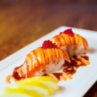 Salmon Belly Torched Nigiri · 2 pieces salmon belly torched served with chef's special sauce.