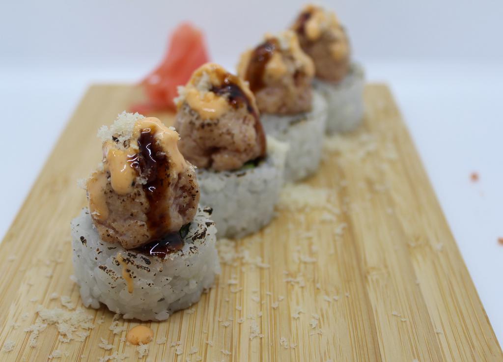 Torched Crunch Spicy Tuna-4pcs · california roll topped with torched spicy tuna, crunch, spicy mayo and eel sauce