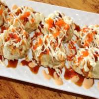 Crab Cake Tempura (Deep Fried) · Real crab, crab stick, cream cheese, topped with scallion, eel sauce, spicy mayo, Japanese m...