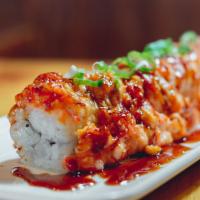 Yaki Maki (Baked) · Shrimp tempura, crunch flakes, topped with salmon, scallion, creamy sauce, eel sauce