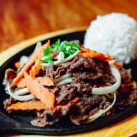 Beef Bulgogi (Korean BBQ) · Thin slice prime sirloin marinated in a house special sauce served on a sizzle platter.