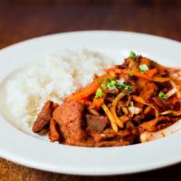 Spicy Pork Bulgogi (Korean BBQ) · Pan-fried​ hot spicy sliced pork and vegetables served on a sizzling platter.
