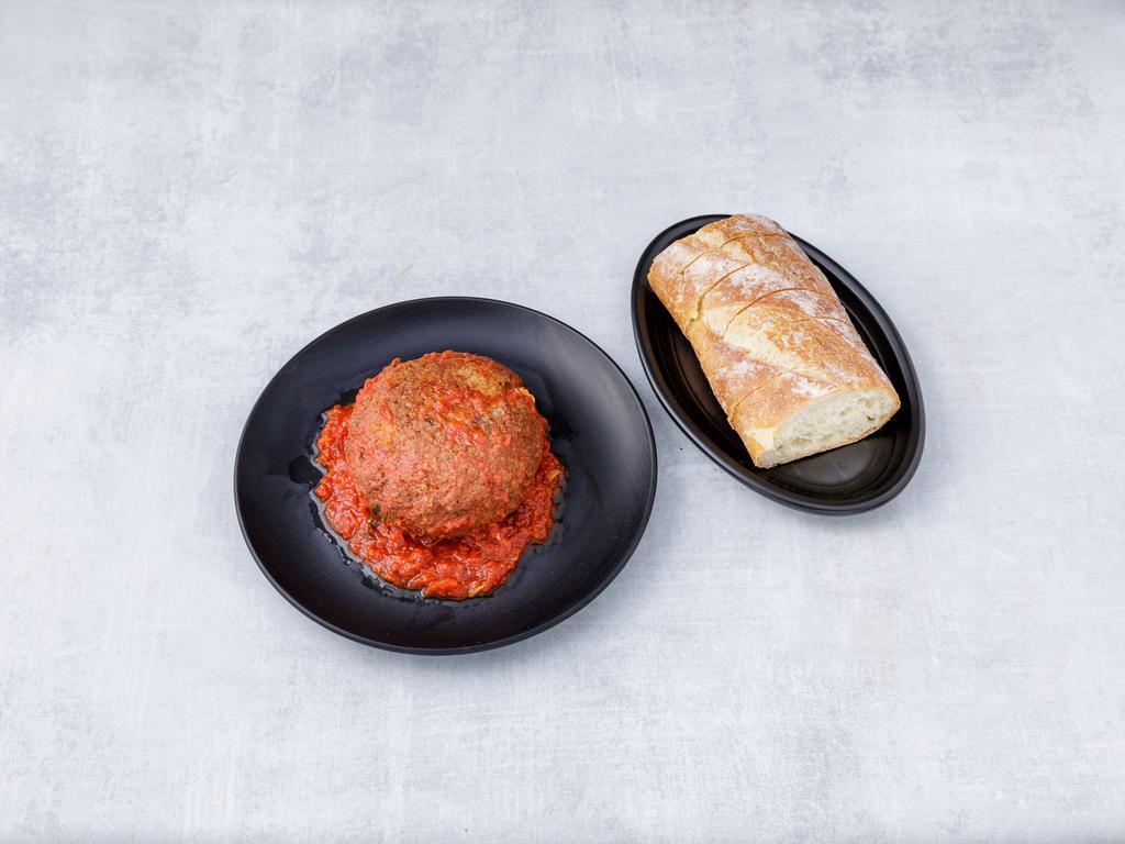 Stuffed Meatball · Beef, breadcrumb, Romano cheese, stuffed with ricotta and mozzarella and baked with tomato sauce.