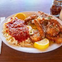 Seafood Combo · Fresh sea bass and shrimp. Breaded, fried, then sauteed in fresh garlic. Served with spaghet...