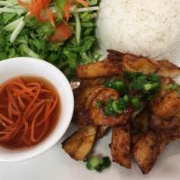 Ricve with Grilled Chicken - Com Ga Nuong · Grilled chicken. Steamed white rice, meat, house salad served with side of homemade fish sau...