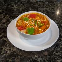 Paneer Tikka Masala · Paneer cubes cooked with bell pepper, onion and tomato gravy simmered with cream.