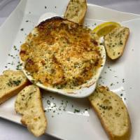 Seafood Gratin · Creamy Seafood Dip, made with Market Fresh Seafood, topped with Butter Seasoned Bread Crumbs...