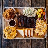 Backyard BBQ Tray · The ultimate crowd pleaser. A half rack of ribs, pulled pork, chili dogs, pickled veggies, B...