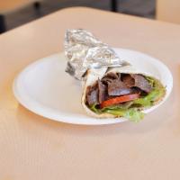 Shawarma Sandwich · Marinated shawarma, flamed-broiled and thinly sliced with tomatoes, onions and lettuce in a ...