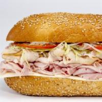 Big T  · Golden Roasted Turkey Breast, Imported Ham & American Cheese. 